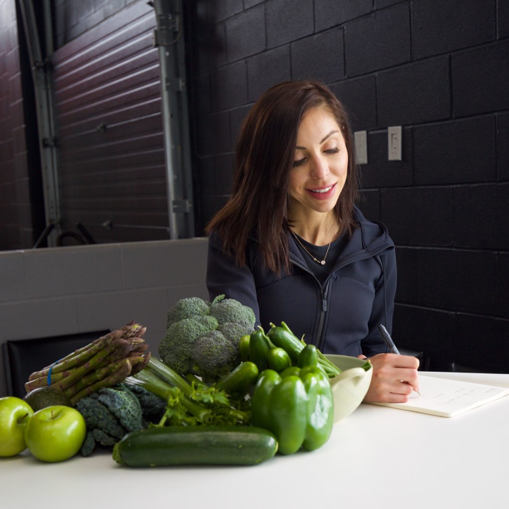 Sports nutrition coach An image of Lisa Spriet planning sports nutrition for a client. Picture includes green vegetables on the table
